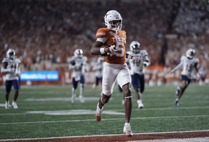 Texas wide receiver Ryan Wingo (5) scores a touchdown on a catch and run against UTSA during the second half of an NCAA college football game in Austin, Texas, Saturday, Sept. 14, 2024. (AP Photo/Eric Gay)