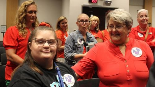 Ashlynn Rich, left, and her mother Linda Ramirez, right, at the June meeting of the Cobb County School Board.