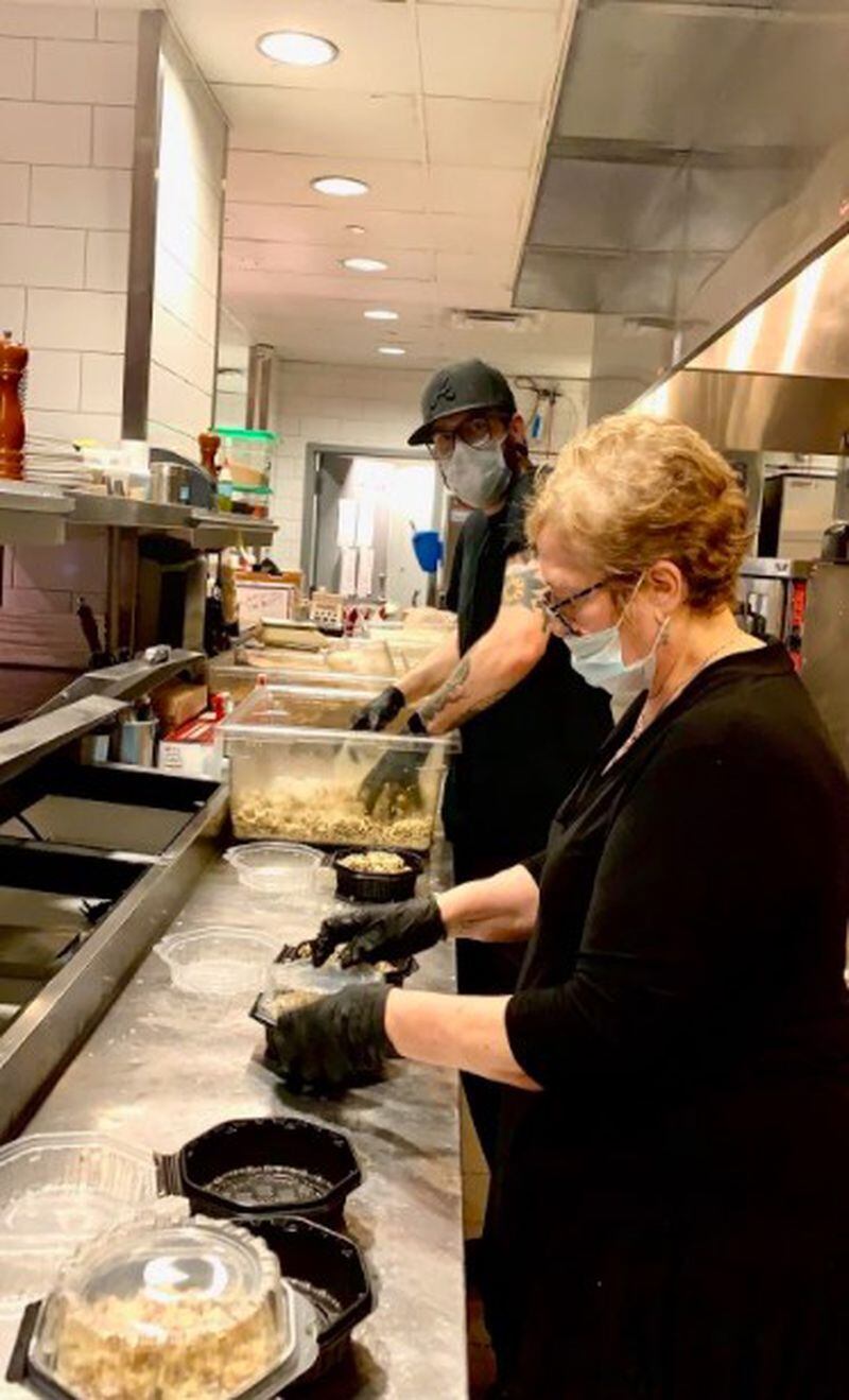 True Story Brands employees cook meals in the kitchen of Biltong Bar for the Frontline Dine initiative serving hospital  personnel at Children's Healthcare of Atlanta. COURTESY OF TRUE STORY BRANDS