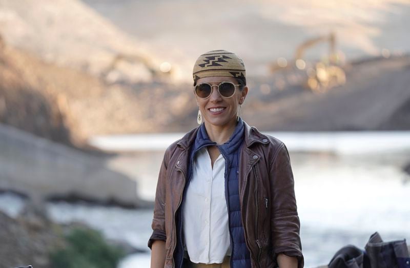 In this image provided by Matthew John Mais, Amy Bowers Cordalis poses at the Iron Gate cofferdam site along the Klamath River on Wednesday, Aug. 28, 2024, in Siskiyou County, Calif. (Matthew John Mais via AP)