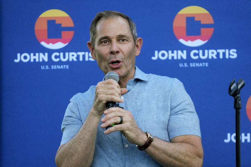 U.S. Rep. John Curtis addresses supporters after his win during an election night party, Tuesday, June 25, 2024, in Provo, Utah. Curtis has won the Utah GOP primary for Mitt Romney's open U.S. Senate seat, defeating one opponent who was endorsed by former President Donald Trump and others who said they supported Trump's agenda. (AP Photo/Rick Bowmer)