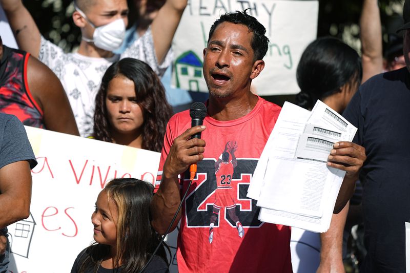 Resident Juan Carlos Jimenez speaks during a rally staged by the East Colfax Community Collective to address chronic problems in the apartment buildings occupied by people displaced from their home countries in central and South America Tuesday, Sept. 3, 2024, in Aurora, Colo. (AP Photo/David Zalubowski)