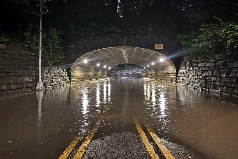 This photo provided by the Central Park Precinct of the New York City Police Department, Aug. 18, 2024, shows the flooded 86th Street transverse road through New York's Central Park. (New York City Police Department via AP)