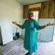 Dorothy Williams, who was displaced from her home after working with an alleged home repair scammer, gestures on Thursday, July 18, 2024 to progress being made after Tyler Perry offered to pay for construction.  (Ziyu Julian Zhu / AJC)