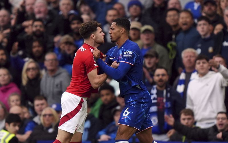 Tempers flare between Nottingham Forest's Neco Williams and Chelsea's Levi Colwill, right, during the English Premier League soccer match between Chelsea and Nottingham Forest at Stamford Bridge in London, Sunday Oct. 6, 2024. (Bradley Collyer/PA via AP)