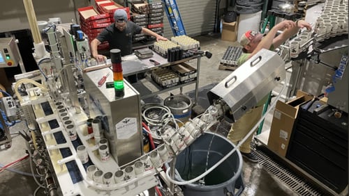 The canning line at Bold Monk Brewing in Atlanta needs both cans and CO2 to package beer. Both were in short supply during 2022, adding to a challenging year for breweries. COURTESY OF BOLD MONK BREWING