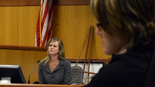 Holly LaBerge, executive director of the state ethics commission, testifies in the whistleblower lawsuit brought by former executive director Stacey Kalberman (right). Kalberman claims she was forced from her position after investigating Gov. Nathan Deal's campaign.