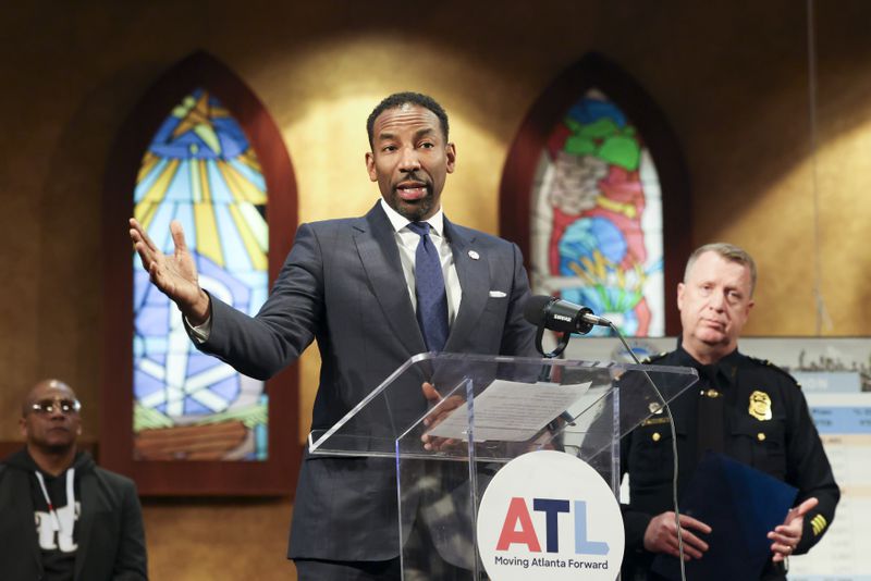 Atlanta Mayor Andre Dickens speaks to members of the media during a press conference next to Atlanta Police Department Chief Darin Schierbaum, right, to discuss reduced crime rate in Atlanta at Salem Bible Church, Thursday, Jan. 4 in Atlanta. (Jason Getz / Jason.Getz@ajc.com)