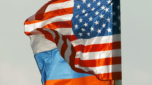 FILE - U.S. and Russian national flags wave on the wind in Moscow's Vnukovo airport, Russia, April 11, 2017 to welcome a U.S. dignitary. (AP Photo/ Ivan Sekretarev, file)