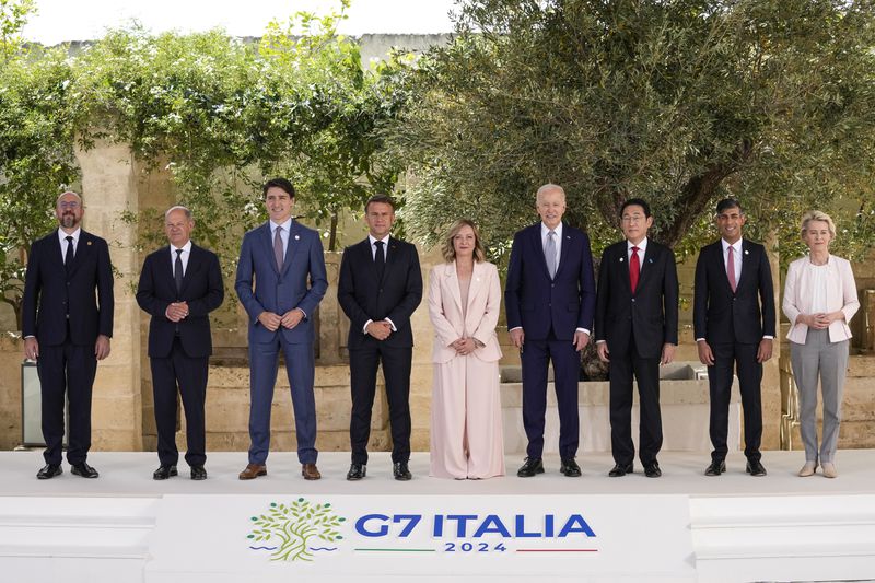 FILE - From left, European Council President Charles Michel, German Chancellor Olaf Scholz, Canada's Prime Minister Justin Trudeau, French President Emmanuel Macron, Italian Prime Minister Giorgia Meloni, U.S. President Joe Biden, Japan's Prime Minister Fumio Kishida, Britain's Prime Minister Rishi Sunak and European Commission President Ursula von der Leyen stand for a group photo at the G7, Thursday, June 13, 2024, in Borgo Egnazia, Italy. Pope Francis is taking his call for artificial intelligence to be developed and used according to ethical lines to the Group of Seven nations’ meeting in Puglia. (AP Photo/Alex Brandon, File)