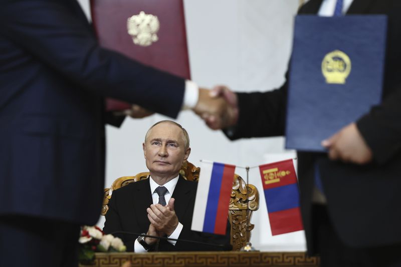 Russian President Vladimir Putin attends a signing ceremony following the Russian-Mongolian talks at the Government Palace in Ulaanbaatar, Mongolia, Tuesday, Sept. 3, 2024. (Sofia Sandurskaya, Sputnik, Kremlin Pool Photo via AP)