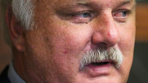 Former Douglas County District Attorney David McDade settled ethics complaints against him Thursday and agreed to pay an $8,000 fine. John Spink, jspink@ajc.com