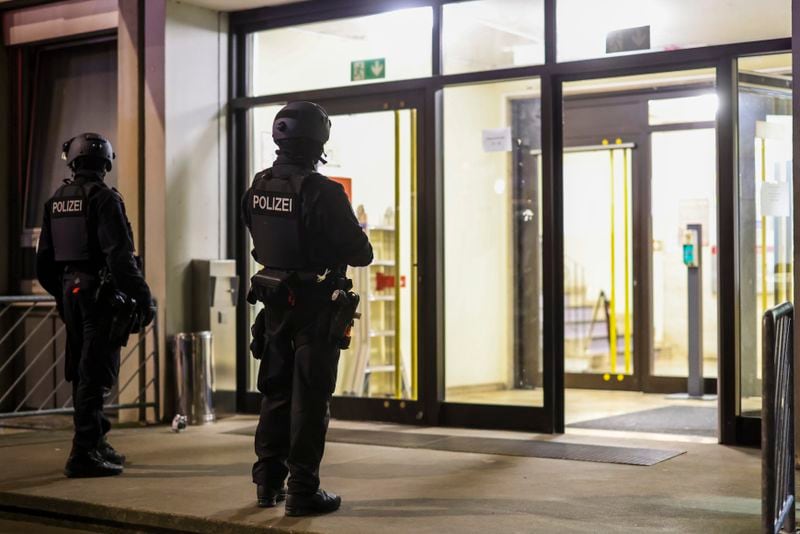 Special police forces carry out an operation at a refugee shelter in Solingen, Germany, on Saturday, Aug. 24, 2024, during an investigation into a fatal knife attack at the city's 650th anniversary celebrations. (Christoph Reichwein/dpa via AP)