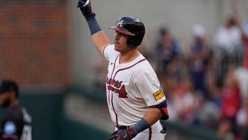 Atlanta Braves' Austin Riley gestures as he rounds the bases after hitting as solo-home rin in the first inning of a baseball game against the Miami Marlins, Thursday, Aug. 1, 2024, in Atlanta. (AP Photo/John Bazemore)