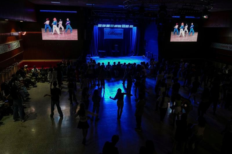 Teenagers dance to K-pop, popular Korean music, at a cultural house in Havana, Cuba, Saturday, Sept. 7, 2024. (AP Photo/Ramon Espinosa)