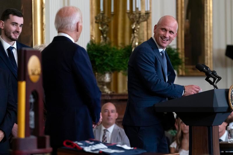 University of Connecticut Men's Basketball Team Coach Dan Hurley speaks as President Joe Biden, left, looks on, in the East Room of the White House in Washington, Tuesday, Sept. 10, 2024, during an event to welcome University of Connecticut Huskies Men's Basketball Team to celebrate their 2023-2024 NCAA championship season. (AP Photo/Jose Luis Magana)