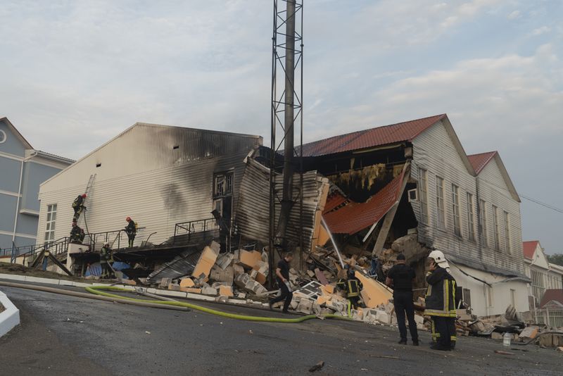 Firefighters extinguish a fire after a rocket hit a building of a higher education institution in the Ukrainian capital Kyiv, Monday, Sept. 2, 2024..(AP Photo/Vasilisa Stepanenko)