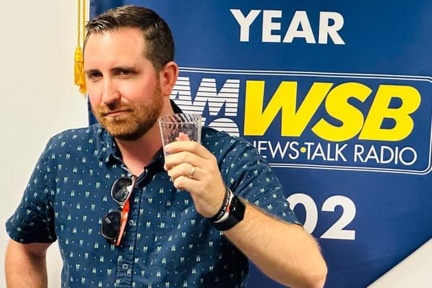 Doug Turnbull at his going away party at WSB radio on Sept. 6, 2024, his final day after 20 years at the station. SPECIAL/MARK MCKAY