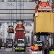 SAVANNAH, GA - DECEMBER 17, 2021: Longshoremen load and unload containers at the Georgia Ports Authority Garden City Terminal. Recently, in coordination with the U.S. Department of Transportation, the Georgia Ports Authority improved its cargo flow by increasing rail capacity and activating flexible "pop-up" container yards near manufacturing and distribution centers. (AJC Photo/Stephen B. Morton)