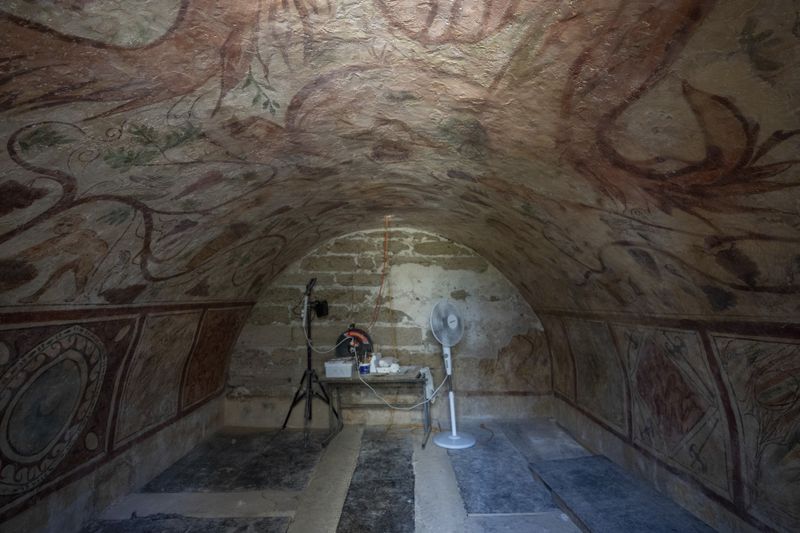 A view of the archeological tomb site in Ashkelon, Israel, Tuesday, Aug. 27, 2024. The tomb with wall paintings depicting Greek mythological figures is at least 1,700 years old said the Israeli Antiquities Authority, whose workers are restoring the site. (AP Photo/Ohad Zwigenberg)