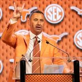 Texas football coach Steve Sarkisian flashes the "Hook 'Em Horns" sign after speaking at the SEC Media Days on Wednesday, July 17, 2024, in Dallas. (AP Photo/Jeffrey McWhorter)