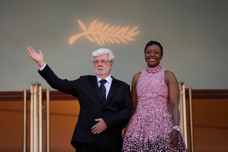 George Lucas, left, and Mellody Hobson pose for photographers upon arrival at the awards ceremony during the 77th international film festival, Cannes, southern France, Saturday, May 25, 2024. (Photo by Andreea Alexandru/Invision/AP)