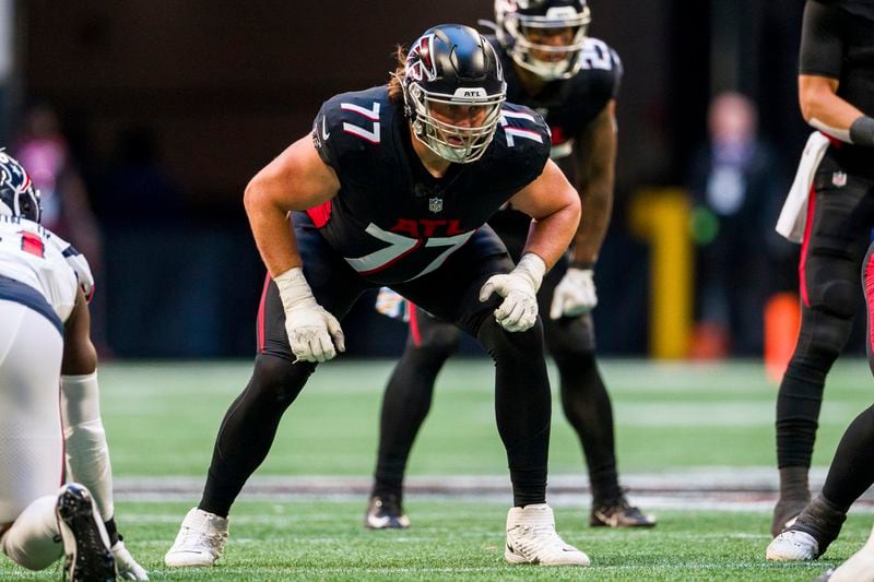 Atlanta Falcons offensive tackle Storm Norton (77) lines up during the second half of an NFL football game against the Houston Texans, Sunday, Oct. 8, 2023, in Atlanta. The Atlanta Falcons won 21-19. (AP Photo/Danny Karnik)