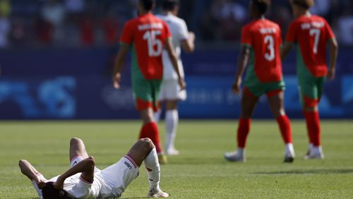 Nathan Harriel of the United States reacts after losing 4-0 in the quarterfinal men's soccer match between Morocco and the United States at the Parc des Princes during the 2024 Summer Olympics, Friday, Aug. 2, 2024, in Paris, France. (AP Photo/Aurelien Morissard)