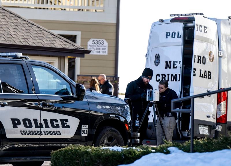 Colorado Springs Police Department investigators and officers work on the scene of a burglary that resulted in the deaths of two people at the Palomino Ranch apartment complex on Tuesday, Dec. 19, 2023 in Colorado Springs, Colo. ( Parker Seibold/The Gazette via AP)