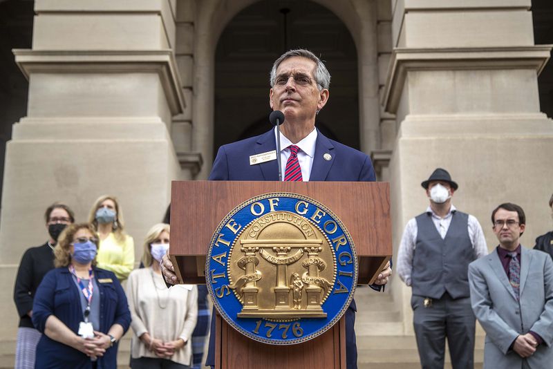 With a handful of Georgia county elections directors behind him, Georgia Secretary of State Brad Raffensperger announces the start of a hand recount of the November 3 presidential election during a briefing outside of the Georgia State Capitol building in downtown Atlanta on Wednesday, November 11, 2020. (Alyssa Pointer/Atlanta Journal-Constitution/TNS)