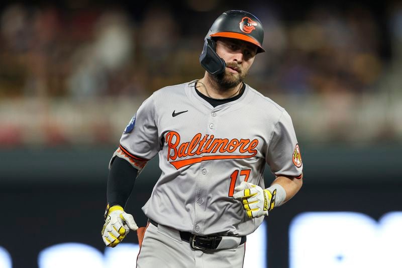 Baltimore Orioles' Colton Cowser runs the bases after hitting a solo home run against the Minnesota Twins during the seventh inning of a baseball game, Friday, Sept. 27, 2024, in Minneapolis. (AP Photo/Matt Krohn)