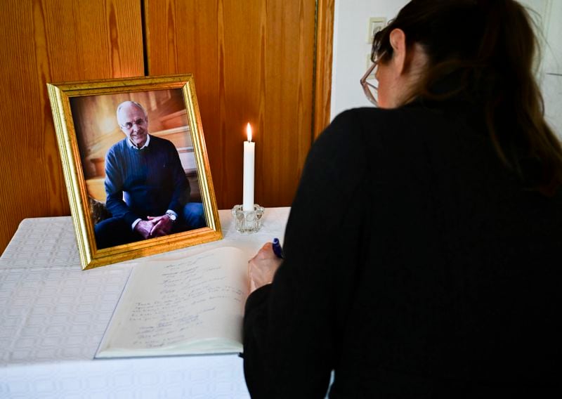 A woman signs a condolence book for the late Swedish soccer coach Sven-Goran Eriksson at the pastor's office in Torsby, Sweden, Thursday, Sept. 12, 2024. (Jonas Ekströmer/TT News Agency via AP)