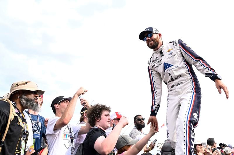 Driver Ross Chastain greets fans prior to a NASCAR Cup Series auto race at Charlotte Motor Speedway, Sunday, May 26, 2024, in Concord, N.C. (AP Photo/Matt Kelley)