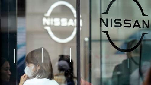 FILE - Logos at a Nissan showroom are seen in Ginza shopping district in Tokyo, March 31, 2023. (AP Photo/Eugene Hoshiko, File)