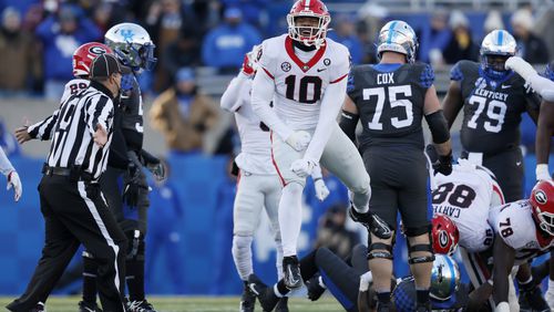 Georgia linebacker Jamon Dumas-Johnson (10) celebrates a stop on fourth-and-1 during the first quarter against Kentucky. (Jason Getz / Jason.Getz@ajc.com)