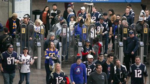 Passengers arrive at the Georgia World Congress Center MARTA stop before the Super Bowl 53 football game between the Los Angeles Rams and New England Patriots, Sunday, Feb. 3, 2019, in Atlanta. BRANDEN CAMP/SPECIAL