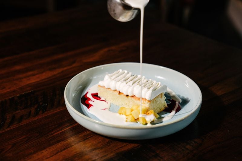 The cinco leches cake at Alta Toro gets milk poured over it at the table. Courtesy of Alta Toro 