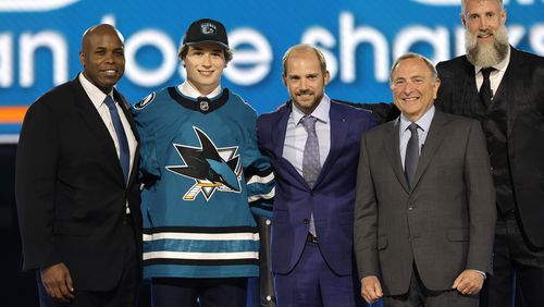 Macklin Celebrini, second from left, poses after being selected by San Jose Sharks during the first round of the NHL hockey draft Friday, June 28, 2024, in Las Vegas. (AP Photo/Steve Marcus)