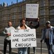 Chagossians Whitney Tranquille, center, attends a protest to response the U.K. announcement to agree to hand sovereignty of the long-contested Chagos Islands to Mauritius and against their "Exclusion" from Chagos negotiations, outside the House of Parliament, in London, Monday, Oct. 7, 2024. (AP Photo/Kin Cheung)