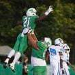 Roswell running back Nick Peal (21) celebrates his rushing touchdown with offensive lineman Kevin Guardado (66) during the second half against Seckinger at Roswell High School, Friday, Sept. 20, 2024, in Roswell, Ga. (Jason Getz / AJC)

