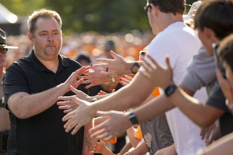 Tennessee head coach Josh Heupel greets fans as the team enters Neyland Stadium before an NCAA college football game against Kent State, Saturday, Sept. 14, 2024, in Knoxville, Tenn. (AP Photo/George Walker IV)