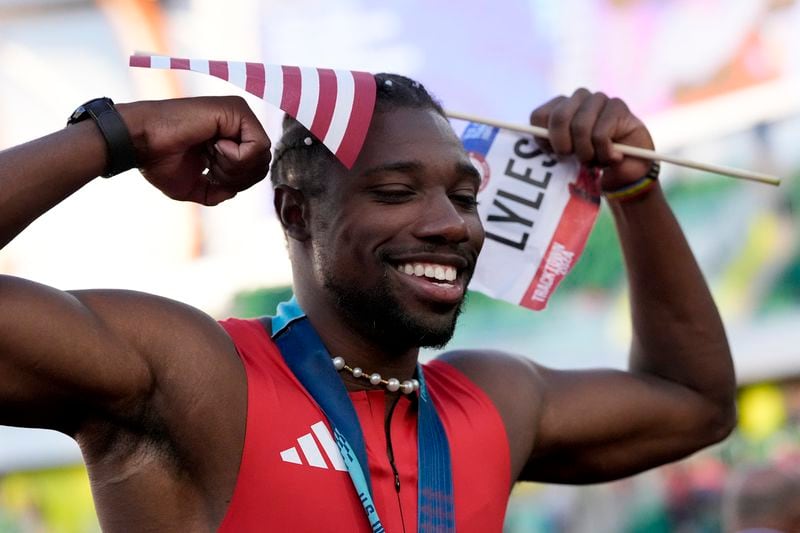 Noah Lyles celebrates after winning the men's 100-meter final during the U.S. Track and Field Olympic Team Trials Sunday, June 23, 2024, in Eugene, Ore. (AP Photo/George Walker IV)