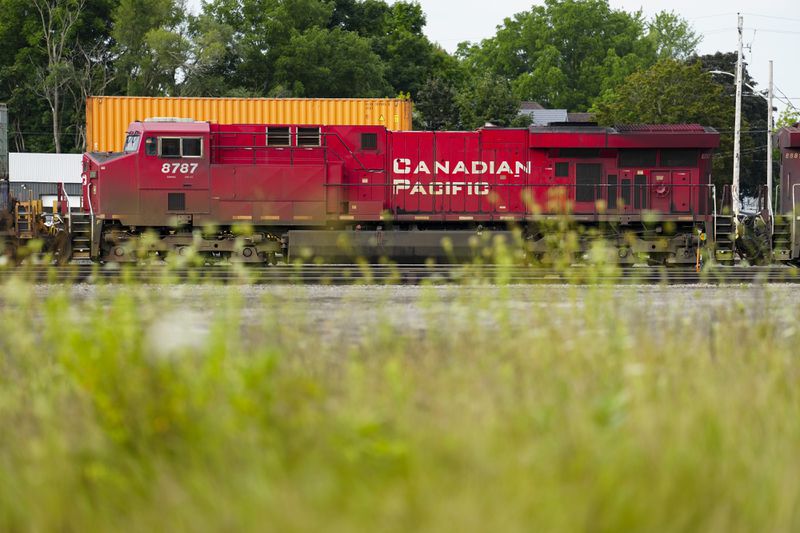 Trains sit idle at a Canadian Pacific Kansas City (CPKC) rail yard in Smiths Falls, Ont., on Thursday, Aug. 22, 2024. (Sean Kilpatrick /The Canadian Press via AP)