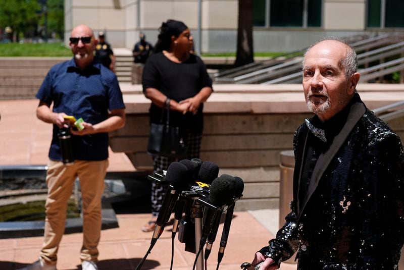 Ed Sanders, right, speaks after the sentencing of the shooter who killed five people and injured 19 others at a Colorado Springs LGBTQ+ club at a hearing in federal court Tuesday, June 18, 2024, in Denver. The shooter pleaded guilty to federal hate crime charges and was sentenced to 55 life terms in prison. (AP Photo/David Zalubowski)