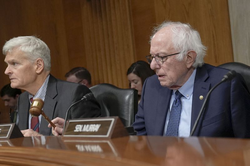 Sen. Bernie Sanders, I-Vt., right, and Sen. Bill Cassidy, R-La., left, during a Senate Health, Education, Labor, and Pensions Committee business meeting on Capitol Hill, Thursday, Sept. 19, 2024, in Washington. (AP Photo/Mariam Zuhaib)