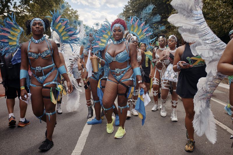 Revelers march during the West Indian Day Parade on Monday, Sept. 2, 2024, in the Brooklyn borough of New York. (AP Photo/Andres Kudacki)