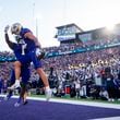 Washington wide receiver Denzel Boston, front, celebrates his touchdown with running back Jonah Coleman (1) during the first half of an NCAA college football game against Michigan, Saturday, Oct. 5, 2024, in Seattle. (AP Photo/Lindsey Wasson)