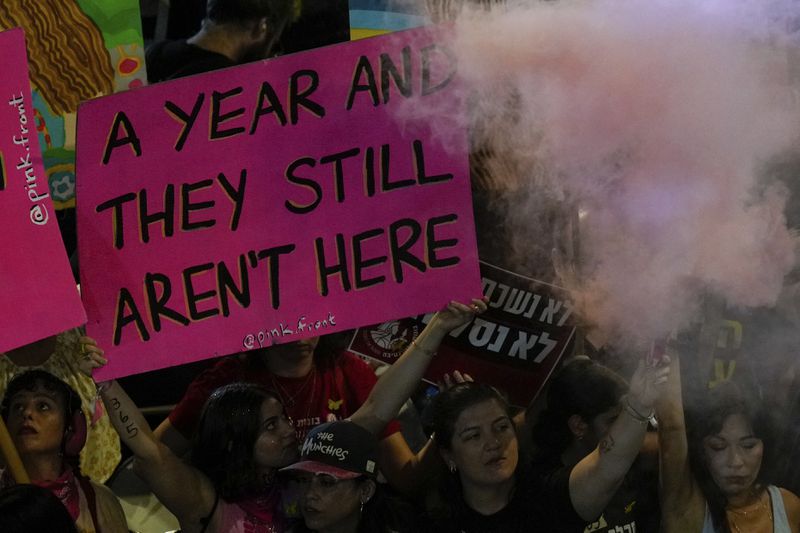 People protest and call for the release of hostages held in the Gaza Strip by the Hamas militant group, in Tel Aviv, Israel, Saturday, Oct. 5, 2024. (AP Photo/Ariel Schalit)