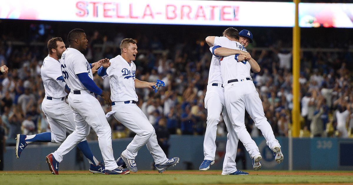 Dodgers celebrate Farmer's walk-off in first Major League at-bat