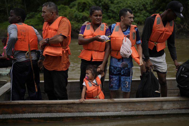 Migrants arrive by boat to Lajas Blancas, Panama, Thursday, Sept. 26, 2024, after their trek across the Darien Gap from Colombia in hopes of reaching the U.S. (AP Photo/Matias Delacroix)